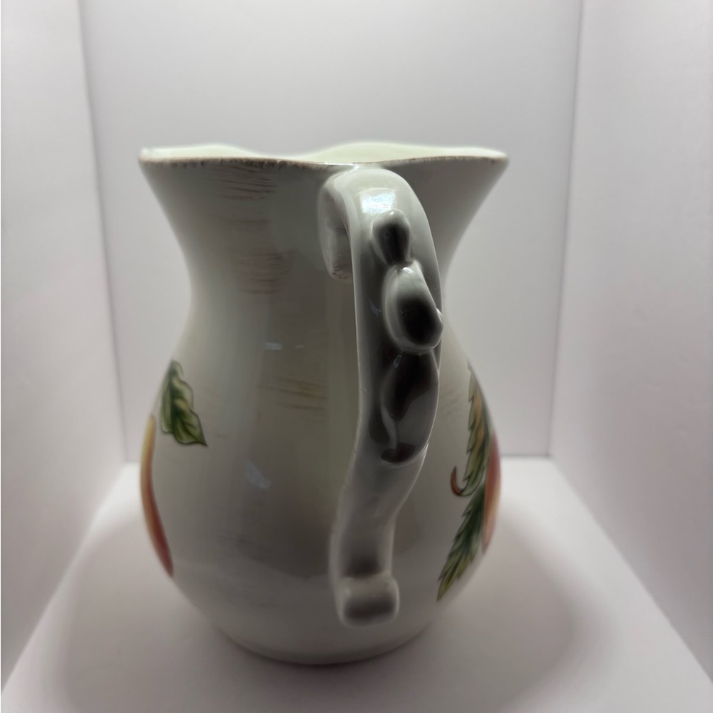 White and Orange Ceramic Art with Fruit Motifs - Picture 4 of 6
